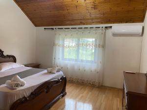 Ένα ή περισσότερα κρεβάτια σε δωμάτιο στο The Hideaway Guesthouse