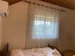 Ένα ή περισσότερα κρεβάτια σε δωμάτιο στο The Hideaway Guesthouse