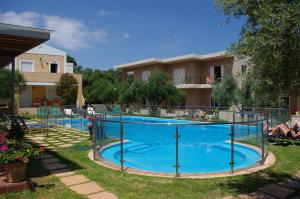 a swimming pool in the yard of a apartment at Elea in Kato Daratso