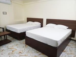 Voodi või voodid majutusasutuse Hotel Krishna toas