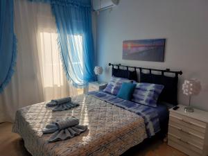 เตียงในห้องที่ Delphitea Philoxenia