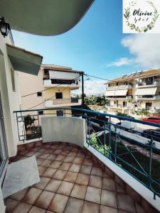 a balcony with a view of a building at Olivóne apt, by A & F in Igoumenitsa