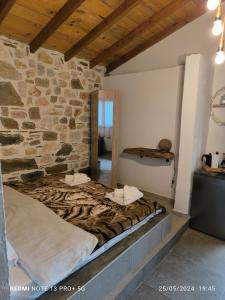 Postel nebo postele na pokoji v ubytování Mountain House Paliouras