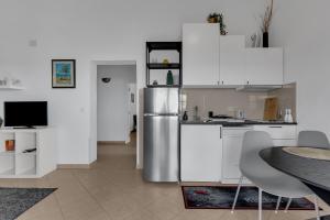 Kuchyň nebo kuchyňský kout v ubytování Apartmani Vanda