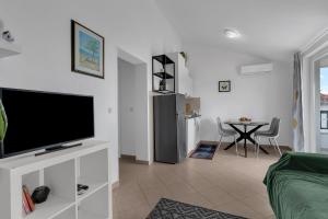 TV a/nebo společenská místnost v ubytování Apartmani Vanda