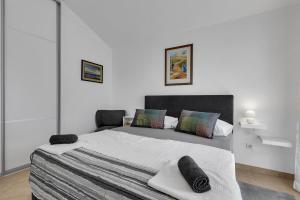 Postel nebo postele na pokoji v ubytování Apartmani Vanda
