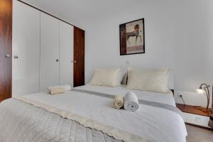 Postel nebo postele na pokoji v ubytování Apartmani Vanda