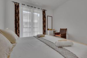 Postel nebo postele na pokoji v ubytování Apartmani Vanda