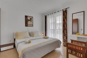 Postel nebo postele na pokoji v ubytování Apartmani Vanda