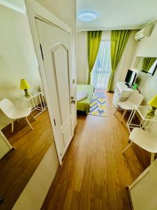 a room with a door open to a living room at Hotel Amfora in St. St. Constantine and Helena