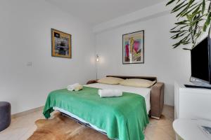 Postel nebo postele na pokoji v ubytování Apartmani Vanda