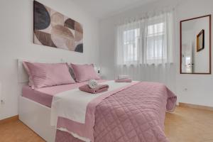 Postel nebo postele na pokoji v ubytování Apartmani Vanda