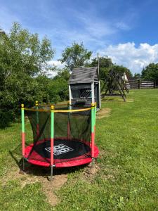 a small playset in a field with at Domki u Bejdaka in Bereżnica Wyżna
