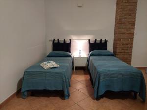 Postel nebo postele na pokoji v ubytování B&B Cala Seggiola