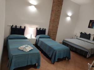 Postel nebo postele na pokoji v ubytování B&B Cala Seggiola