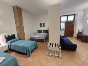 Postel nebo postele na pokoji v ubytování B&B Cala Seggiola
