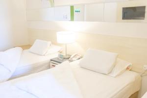 Go Hotels Lanang - Davao客房内的一张或多张床位