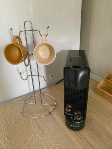 a heater and lights on the floor next to a blender at Adams Apartments in Skala Rachoniou