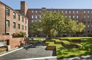 a courtyard with benches in front of a building at S End Loft w Pool Art Gallery Steps to T BOS-356 in Boston