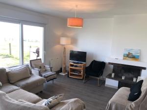 Posezení v ubytování Maison en bord de mer + 16 fotografií