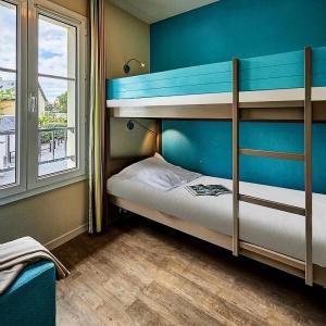 Giường trong phòng chung tại Résidence Port Guillaume - maeva Home - Appartement 3 pièces 6 personnes - Budget MAE-9231