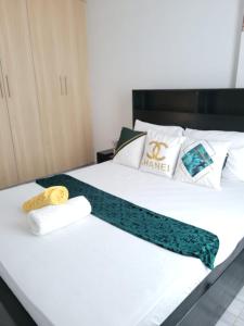 Postel nebo postele na pokoji v ubytování Rubbie Luxury