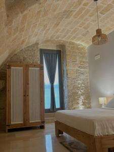 Postel nebo postele na pokoji v ubytování Terra di Trani