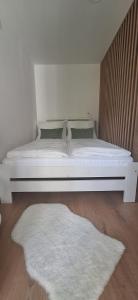 En eller flere senge i et værelse på Apartmán GIGI Rezort Linea + 17 billeder