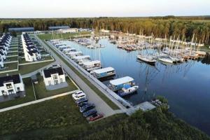 an aerial view of a marina with boats in the water at Ferienhaus am Yachthafen in Peenemünde in Peenemünde