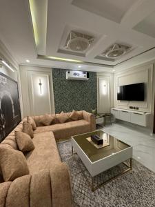 a living room with a couch and a coffee table at Emerald Villa 2 in Islamabad