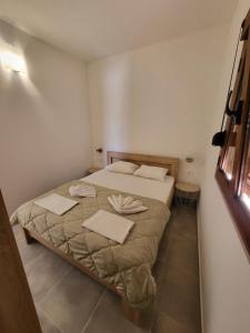 Cama ou camas em um quarto em Arabela Bungalovi