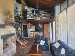 a living room with a couch and a fireplace at La Soñada San Bernardino in San Bernardino