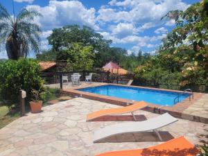 a swimming pool in a yard with a stone patio and a resort at La Soñada San Bernardino in San Bernardino