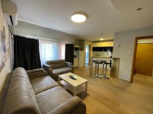 a living room with a couch and a table at Leo in Niš