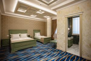 Postel nebo postele na pokoji v ubytování Ervini Boutique Hotel