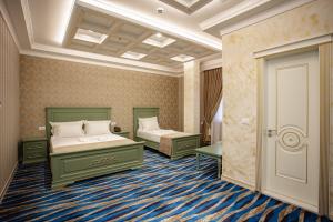 Postel nebo postele na pokoji v ubytování Ervini Boutique Hotel
