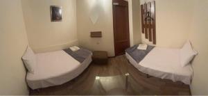 Ліжко або ліжка в номері ENIGMA HOSTEL