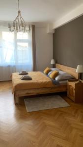 a bedroom with a large bed and a window at Anenska by Charles Bridge 3 in Prague