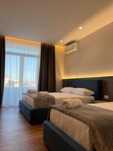 Postel nebo postele na pokoji v ubytování North Alb Hotel