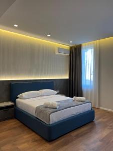 Postel nebo postele na pokoji v ubytování North Alb Hotel