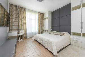 Postel nebo postele na pokoji v ubytování Airport Hotel Roomsity Pride