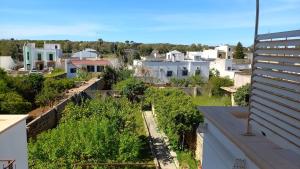 a view of a city from the roof of a building at Appartamento nel salento CASAMALENA in Acquarica del Capo