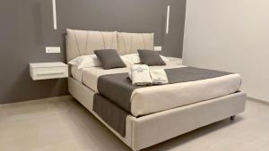 Postel nebo postele na pokoji v ubytování Le Stagioni Rooms