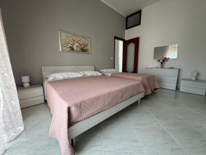 Postel nebo postele na pokoji v ubytování Domus Caiazzo