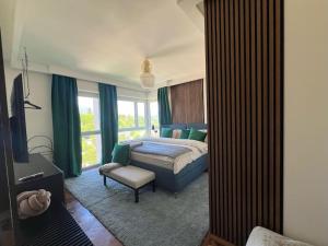 Postel nebo postele na pokoji v ubytování Panorama Suite in Lugano - Pazzallo