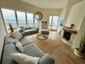 Posezení v ubytování COAST HOUSE Sky Suite
