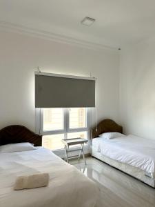 Voodi või voodid majutusasutuse VILLA seeb 2 MIN walk to the beach toas
