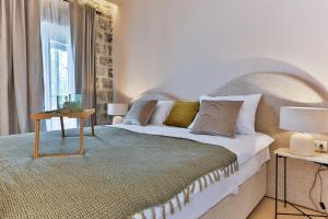 a bedroom with a large bed and a window at Boutique hotel Ruzmarin SPA & Garden by Aycon in Budva