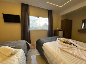 A bed or beds in a room at Dima Pyramids View