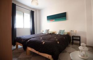 a bedroom with a large bed in a room at Mar y montaña in Monachil